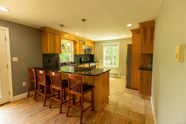36 Harris Road Ext, Salem, CT 06420 - kitchen featuring stainless steel appliances, a peninsula, baseboards, a sink, and tasteful backsplash