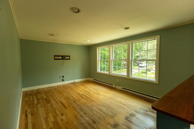 36 Harris Road Ext, Salem, CT 06420 - empty room with light wood-style flooring, baseboards, a baseboard heating unit, recessed lighting, and crown molding