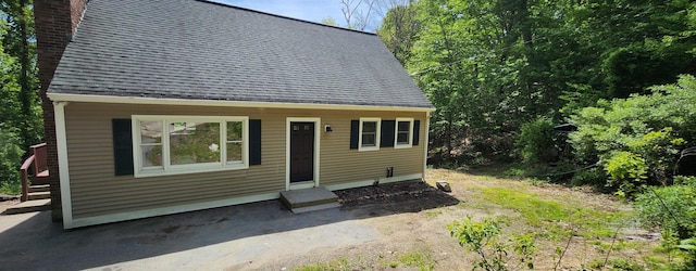 552 Squaw Rock Rd, Plainfield, CT 06354 - view of front of house featuring a chimney and roof with shingles