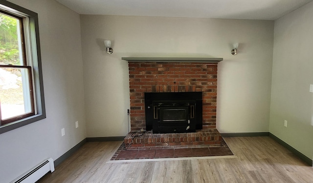 552 Squaw Rock Rd, Plainfield, CT 06354 - detailed view of a baseboard heating unit, wood finished floors, and baseboards