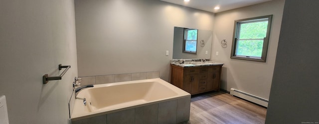 552 Squaw Rock Rd, Plainfield, CT 06354 - full bathroom featuring a baseboard heating unit, vanity, a garden tub, wood finished floors, and recessed lighting