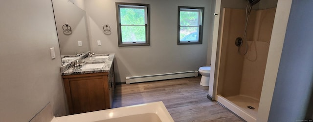 552 Squaw Rock Rd, Plainfield, CT 06354 - full bathroom with a baseboard radiator, wood finished floors, double vanity, and toilet