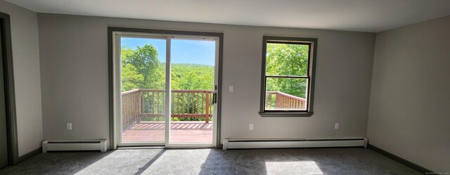 552 Squaw Rock Rd, Plainfield, CT 06354 - doorway featuring a baseboard heating unit, carpet floors, and baseboards