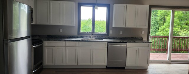 552 Squaw Rock Rd, Plainfield, CT 06354 - kitchen featuring appliances with stainless steel finishes, dark wood-style flooring, and white cabinets