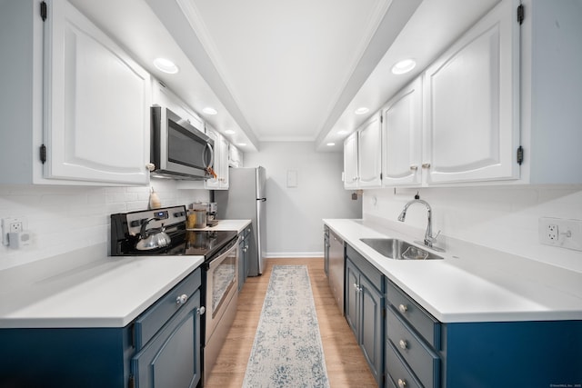 50 Aiken St Apt 463, Norwalk, CT 06851 - kitchen with stainless steel appliances, a sink, recessed lighting, baseboards, and blue cabinetry