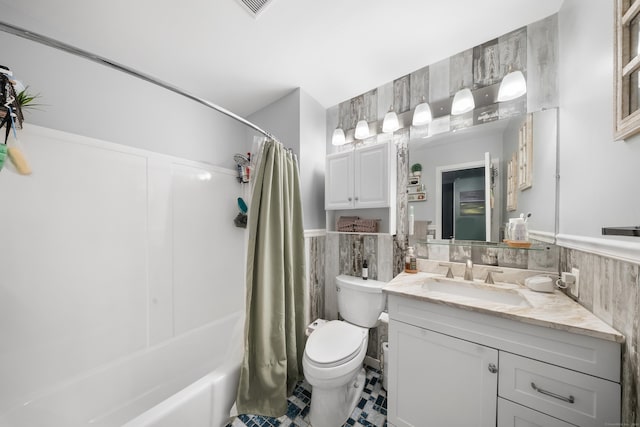 50 Aiken St Apt 463, Norwalk, CT 06851 - bathroom with vanity, tile patterned flooring, a wainscoted wall, tile walls, and toilet