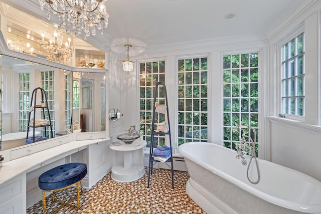 15 Mill Rd, New Canaan, CT 06840 - bathroom featuring a chandelier, a freestanding tub, vanity, and crown molding