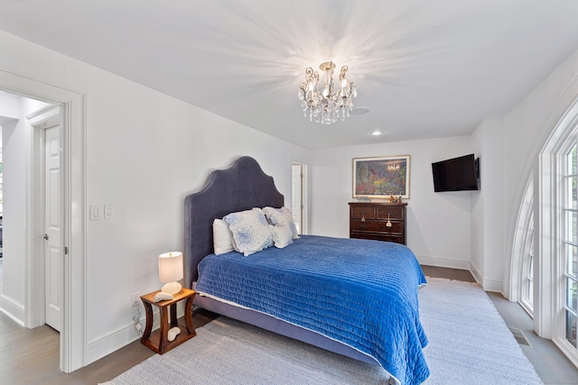 15 Mill Rd, New Canaan, CT 06840 - bedroom with a chandelier, baseboards, and wood finished floors