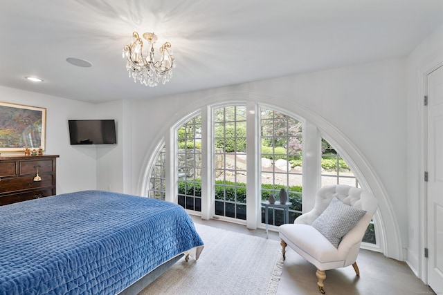 15 Mill Rd, New Canaan, CT 06840 - bedroom with a chandelier and access to exterior