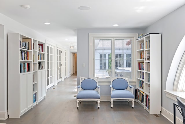 15 Mill Rd, New Canaan, CT 06840 - sitting room with wood finished floors, recessed lighting, and baseboards