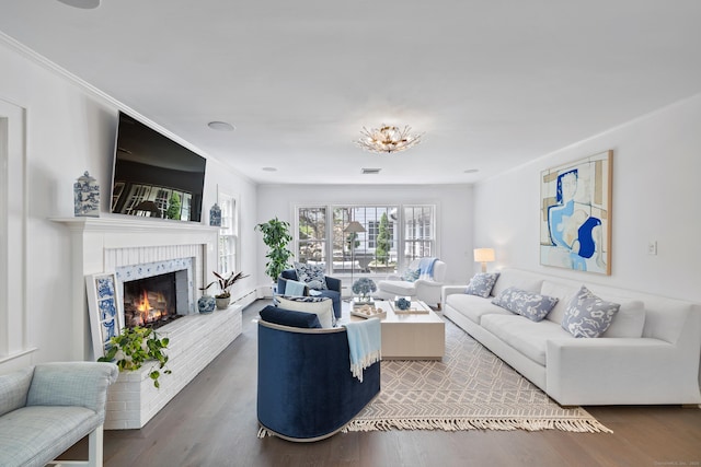 15 Mill Rd, New Canaan, CT 06840 - living area featuring wood finished floors, a fireplace, and ornamental molding