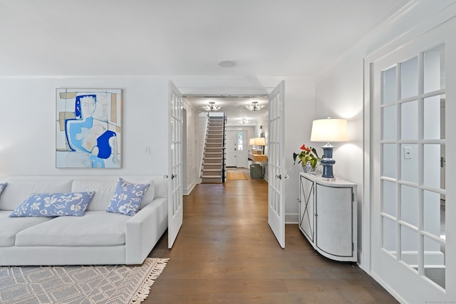 15 Mill Rd, New Canaan, CT 06840 - hallway with wood finished floors, crown molding, stairway, and french doors