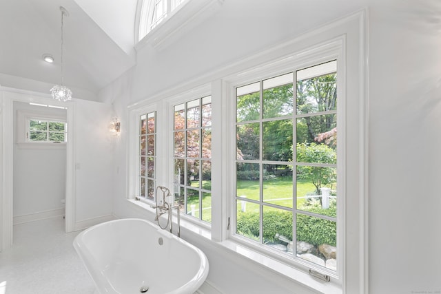 15 Mill Rd, New Canaan, CT 06840 - full bathroom with a freestanding tub, a chandelier, baseboards, toilet, and vaulted ceiling