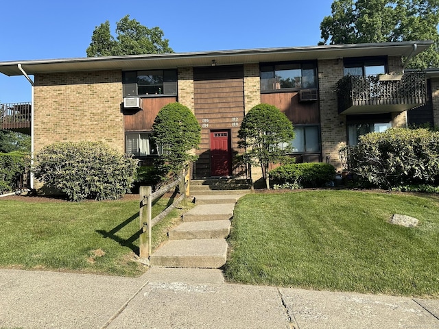 184 Kennedy Dr Unit 184, Bridgeport, CT 06606 - view of front of home featuring brick siding and a front lawn