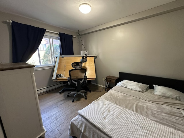 184 Kennedy Dr Unit 184, Bridgeport, CT 06606 - bedroom featuring wood finished floors and baseboard heating