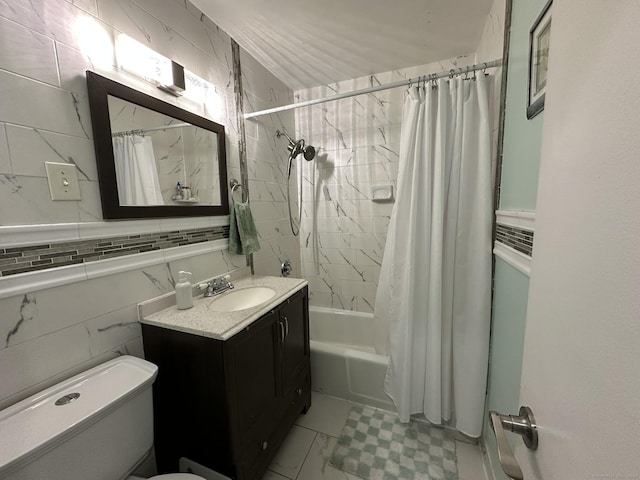 184 Kennedy Dr Unit 184, Bridgeport, CT 06606 - bathroom featuring vanity, shower / bath combo with shower curtain, toilet, and tile walls