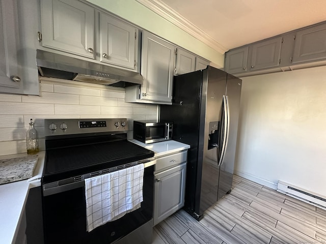 184 Kennedy Dr Unit 184, Bridgeport, CT 06606 - kitchen with stainless steel appliances, under cabinet range hood, gray cabinets, tasteful backsplash, and crown molding
