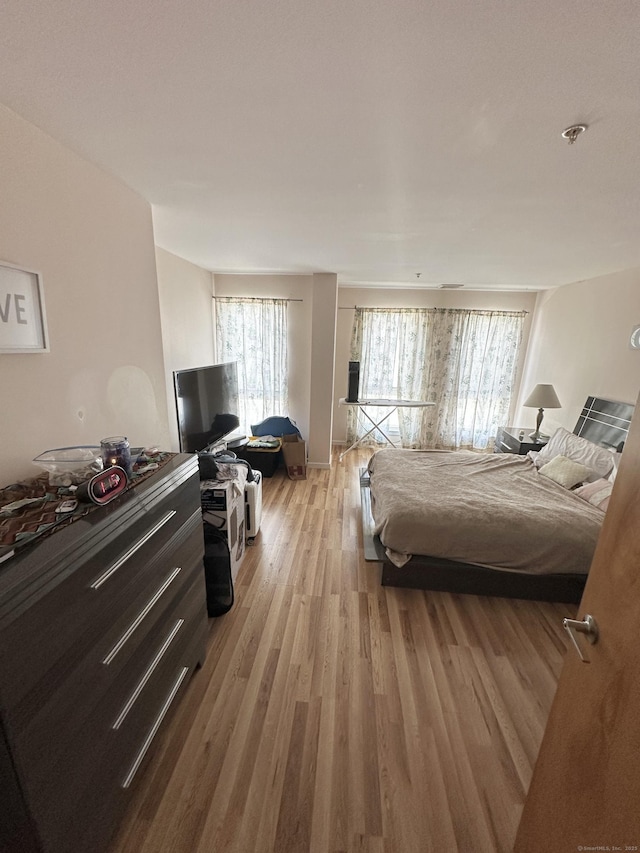 664 Main Ave Apt 302, Norwalk, CT 06851 - bedroom featuring multiple windows and light wood-type flooring