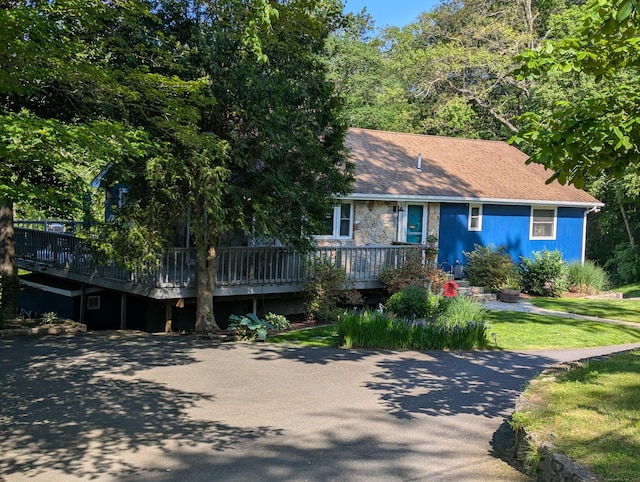 51 Isleib Rd, Marlborough, CT 06447 - view of front of property with a wooden deck, a front yard, and stone siding