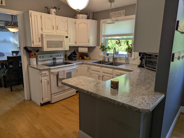 51 Isleib Rd, Marlborough, CT 06447 - kitchen with white appliances, a sink, white cabinetry, and backsplash