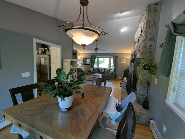 51 Isleib Rd, Marlborough, CT 06447 - dining space featuring a baseboard heating unit, light wood-type flooring, and a ceiling fan