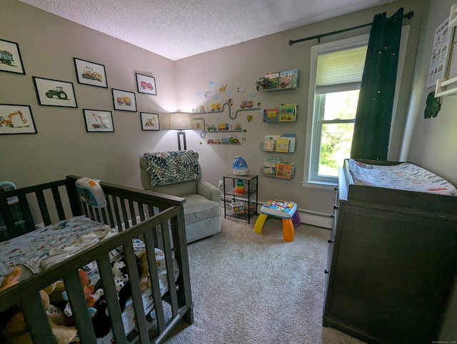 51 Isleib Rd, Marlborough, CT 06447 - bedroom featuring baseboard heating, a textured ceiling, carpet, and a crib