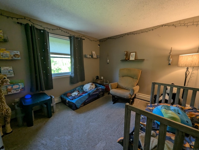 51 Isleib Rd, Marlborough, CT 06447 - carpeted bedroom with a textured ceiling, baseboard heating, and baseboards