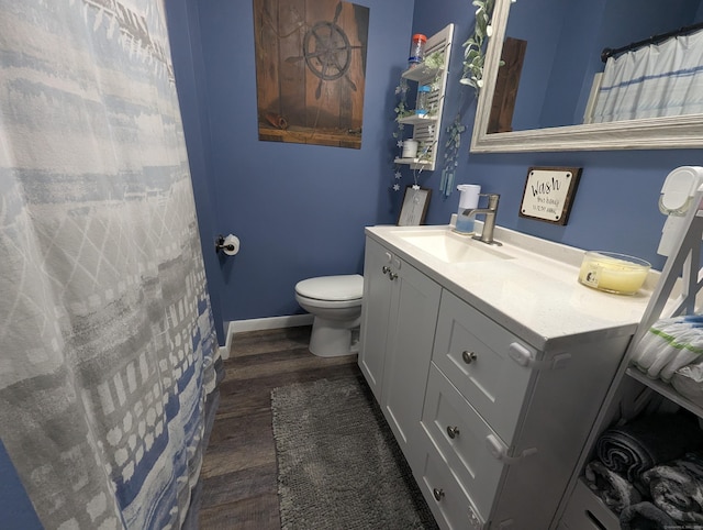 51 Isleib Rd, Marlborough, CT 06447 - bathroom with vanity, toilet, wood finished floors, and baseboards