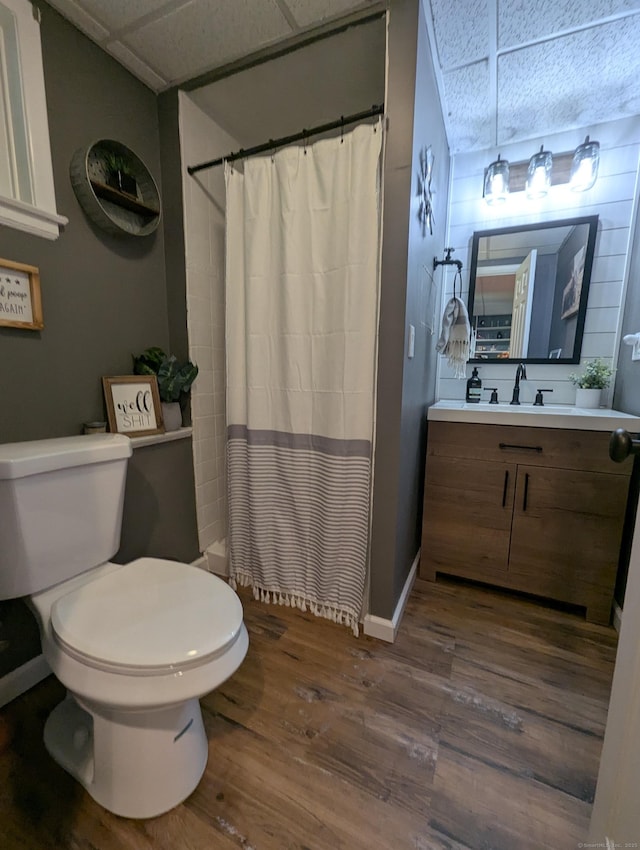 51 Isleib Rd, Marlborough, CT 06447 - full bath featuring wood finished floors, toilet, vanity, baseboards, and a shower with curtain