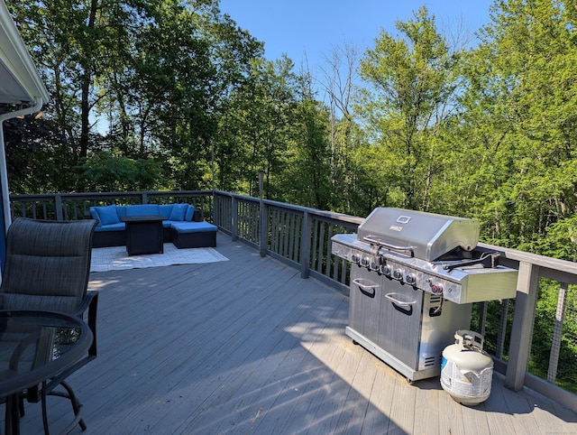 51 Isleib Rd, Marlborough, CT 06447 - wooden terrace with an outdoor hangout area and area for grilling
