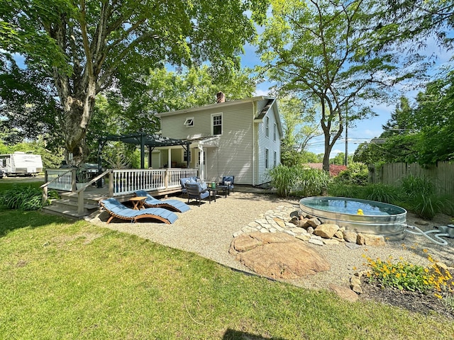 276 Boston Post Rd, East Lyme, CT 06333 - back of house featuring a wooden deck, a pergola, and a chimney