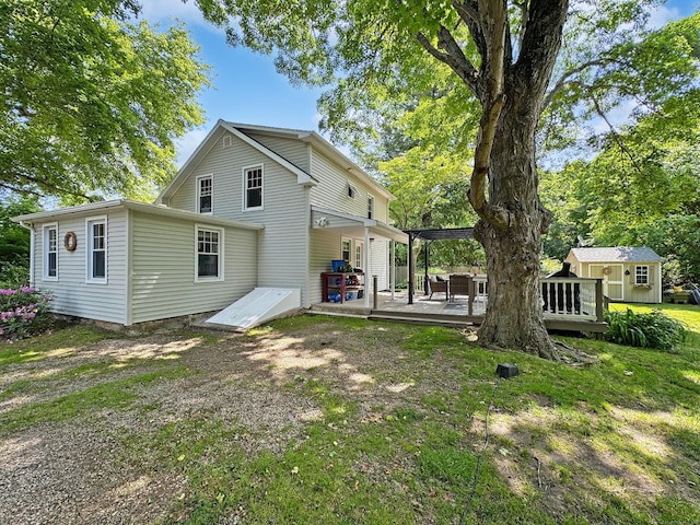 276 Boston Post Rd, East Lyme, CT 06333 - rear view of property with a deck and an outdoor structure