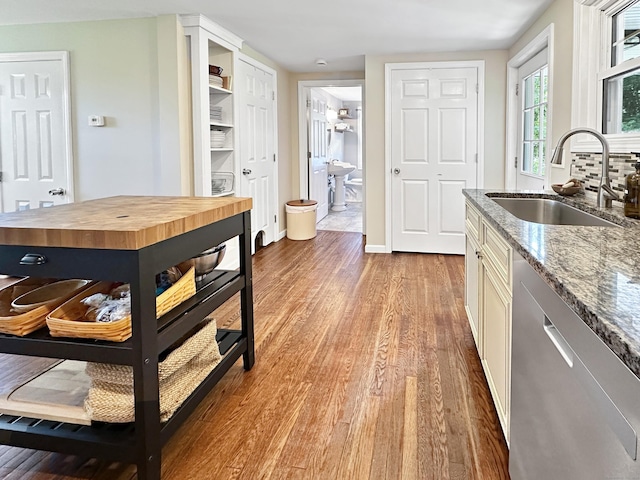 276 Boston Post Rd, East Lyme, CT 06333 - kitchen featuring a sink, stainless steel dishwasher, wood counters, and light wood-type flooring