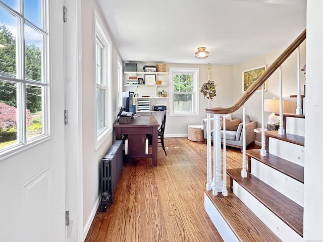 276 Boston Post Rd, East Lyme, CT 06333 - office area featuring radiator, wood finished floors, and baseboards