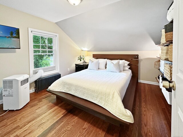 276 Boston Post Rd, East Lyme, CT 06333 - bedroom with radiator heating unit, lofted ceiling, wood finished floors, and baseboards