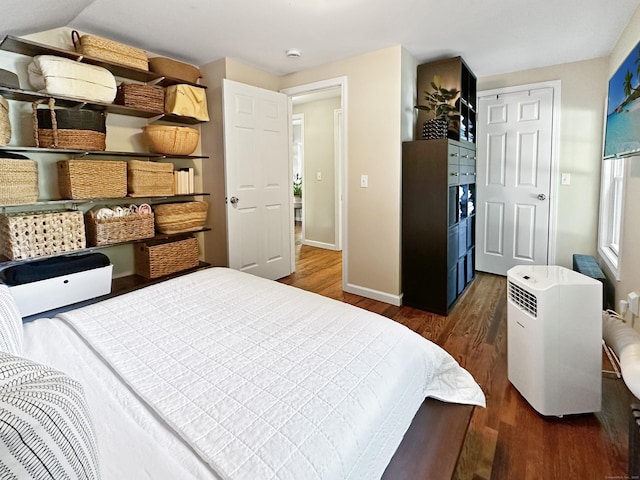 276 Boston Post Rd, East Lyme, CT 06333 - bedroom with dark wood-style flooring and baseboards