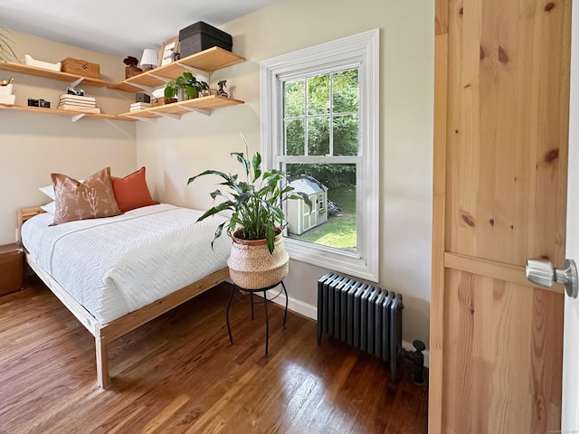 276 Boston Post Rd, East Lyme, CT 06333 - bedroom with radiator heating unit, wood finished floors, and baseboards