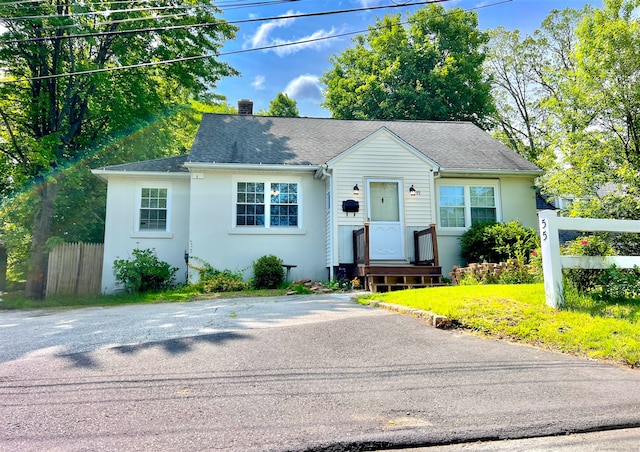 55 Lancaster St, Watertown, CT 06779 - bungalow with stucco siding, a chimney, and a shingled roof