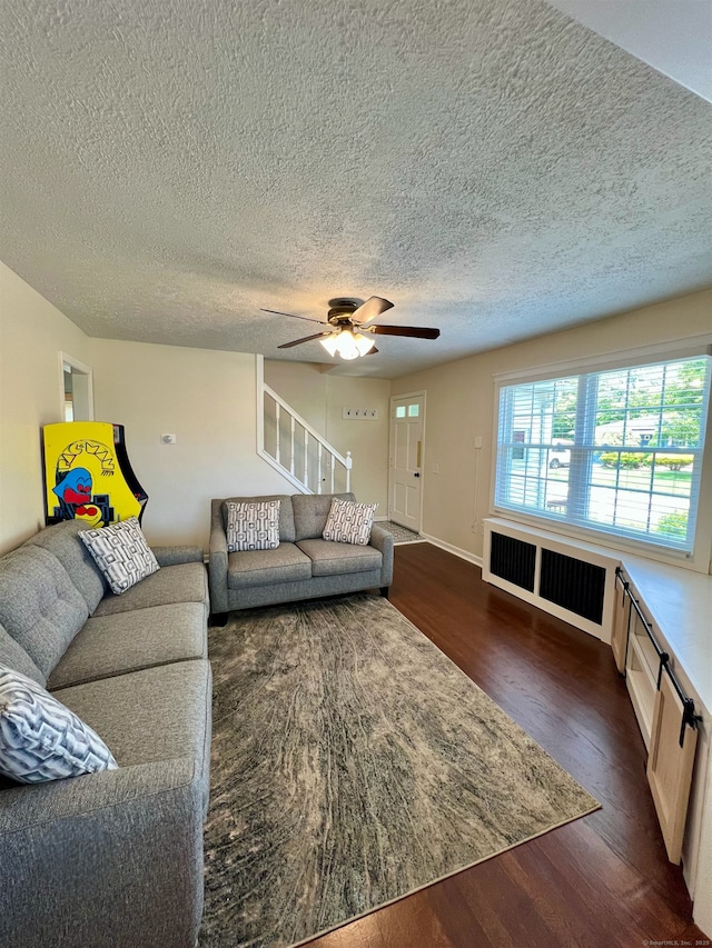 55 Lancaster St, Watertown, CT 06779 - living area featuring radiator, dark wood-style flooring, ceiling fan, a textured ceiling, and baseboards