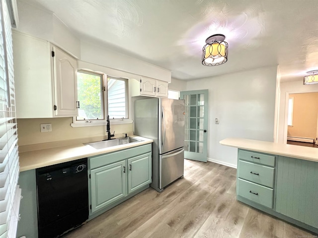 55 Lancaster St, Watertown, CT 06779 - kitchen featuring dishwasher, a sink, freestanding refrigerator, light wood-style floors, and light countertops