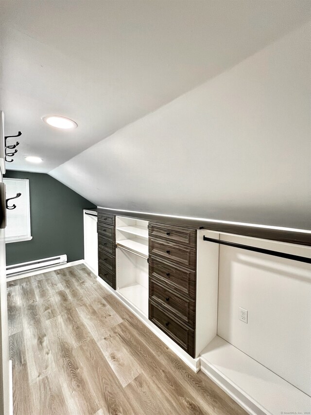 55 Lancaster St, Watertown, CT 06779 - bonus room with a baseboard radiator, lofted ceiling, and wood finished floors