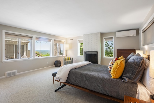 29 Montevideo Rd, Avon, CT 06001 - carpeted bedroom with a wall mounted air conditioner, baseboards, and a fireplace