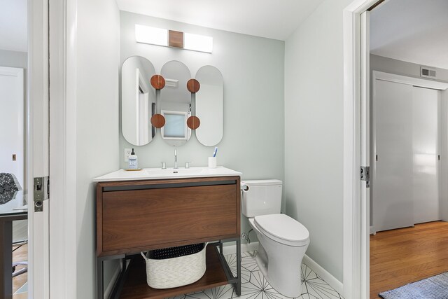 29 Montevideo Rd, Avon, CT 06001 - half bath featuring vanity, toilet, and baseboards