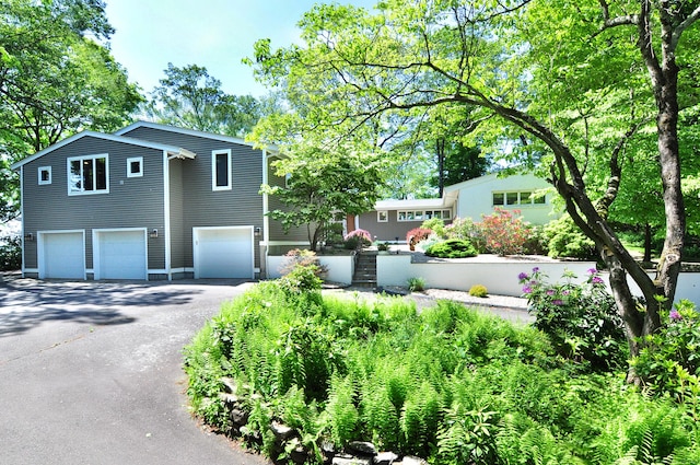 29 Montevideo Rd, Avon, CT 06001 - view of front of house with an attached garage and asphalt driveway
