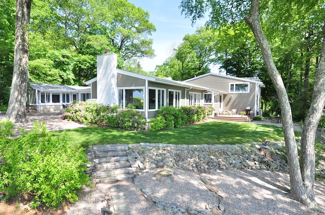 29 Montevideo Rd, Avon, CT 06001 - rear view of house featuring a chimney and a yard