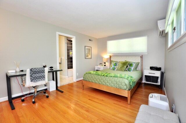 29 Montevideo Rd, Avon, CT 06001 - bedroom with a wall mounted AC, wood finished floors, and baseboards