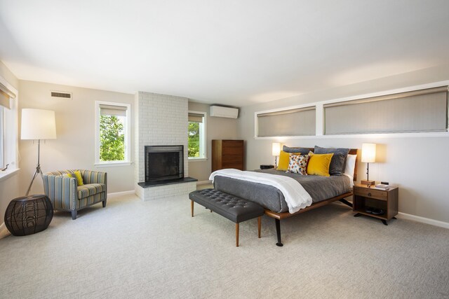 29 Montevideo Rd, Avon, CT 06001 - carpeted bedroom with a wall mounted AC, baseboards, and a brick fireplace