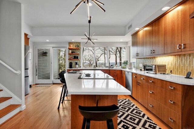 29 Montevideo Rd, Avon, CT 06001 - kitchen featuring stainless steel appliances, a breakfast bar, light wood-type flooring, a kitchen island, and recessed lighting