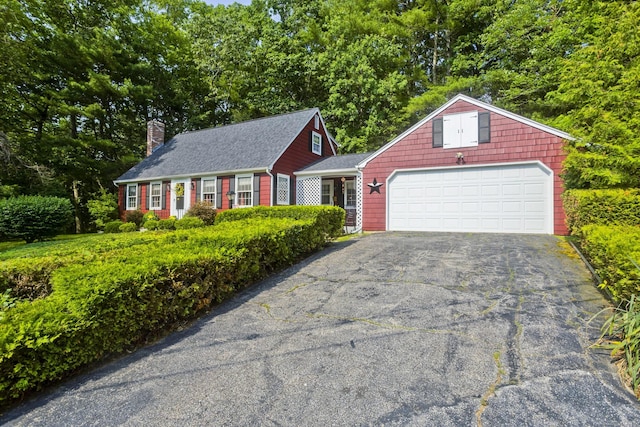 42 Sycamore Ter, Windham, CT 06280 - view of front of home with driveway, a chimney, and an attached garage
