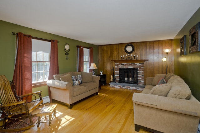 42 Sycamore Ter, Windham, CT 06280 - living room with light wood-style floors, a fireplace, and wooden walls